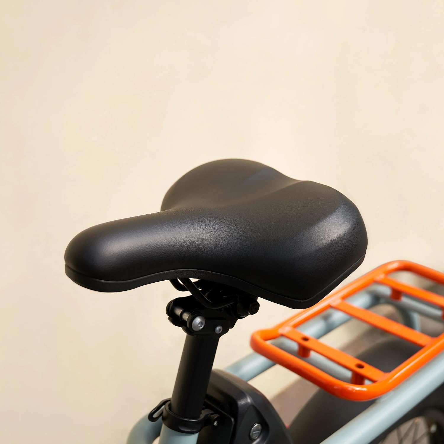 Close-up of the YADEA electric bike's saddle and rear rack, showing adjustability.