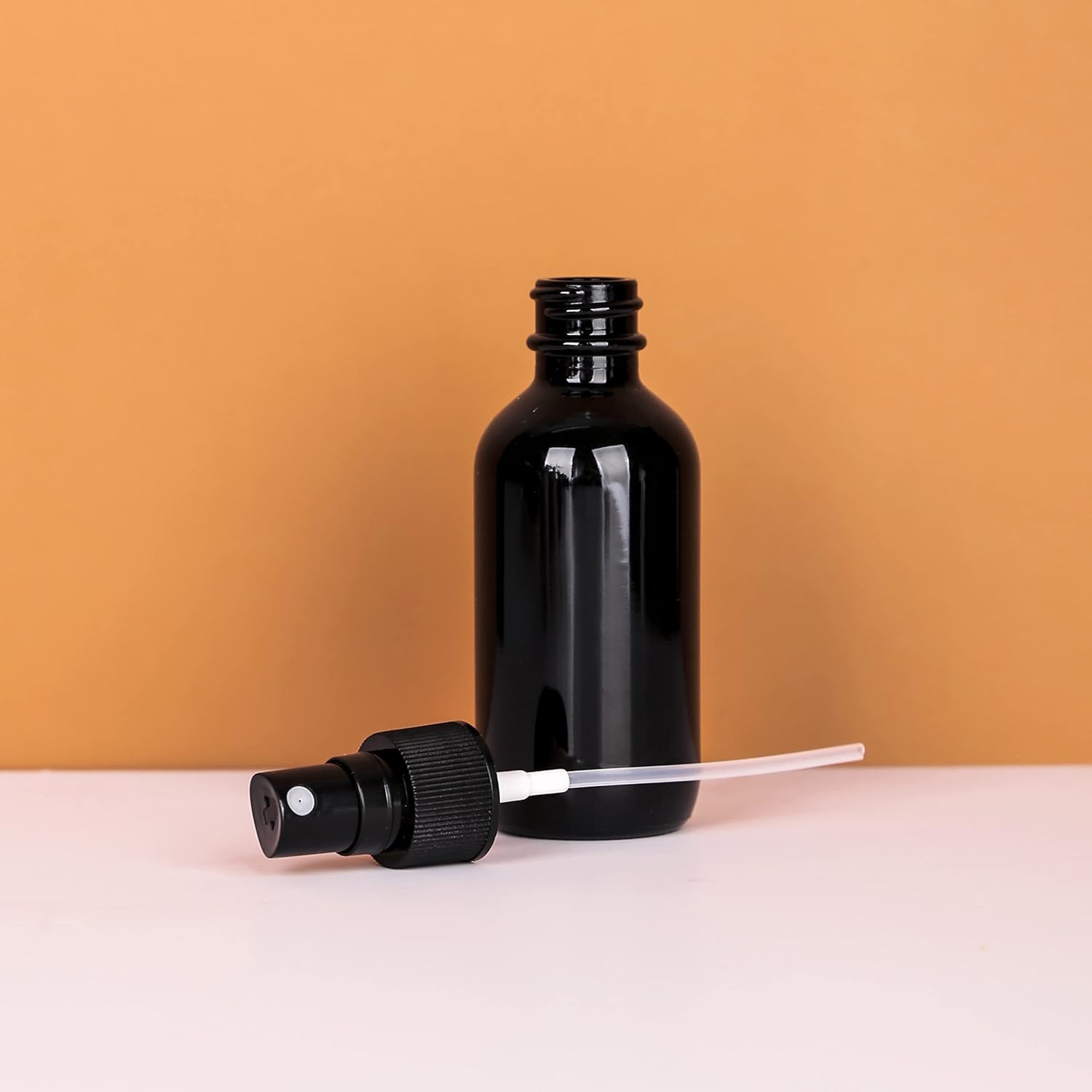 2oz UV Resistant Glass Spray Bottle, Fine Mist Boston Glass Bottles with Black Fine Mist Sprayer Small Clear Bottles for Essential Oils, Bath, Beauty, Hair & Cleaning, Black, Pack of 48