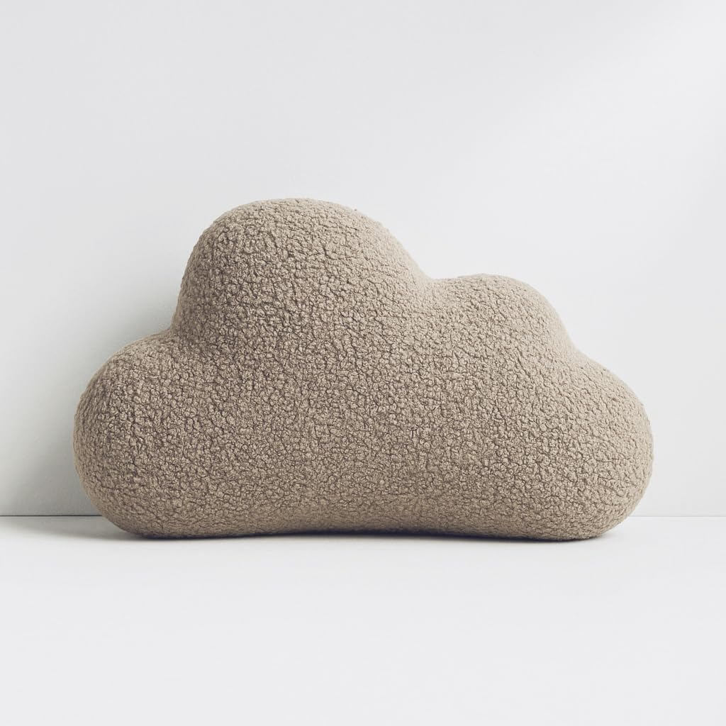 Coussin nuage boucle crème pour décorer un lit d'enfant cocooning