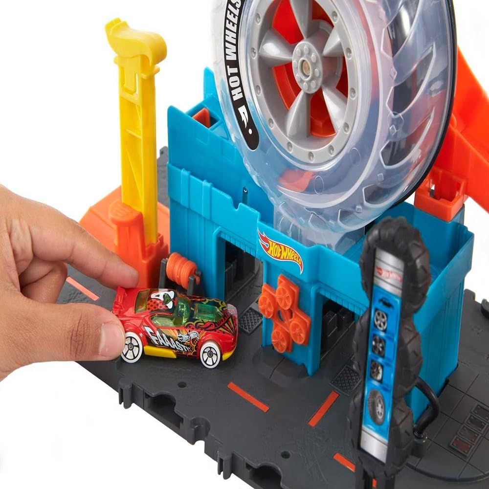 Hot Wheels City Super Twist Tire Shop - Taller con Rueda Gigante - Incluye Coche - Compatible con Conjuntos Hot Wheels - Regalo para Niños de 4-8 Años, HDP02