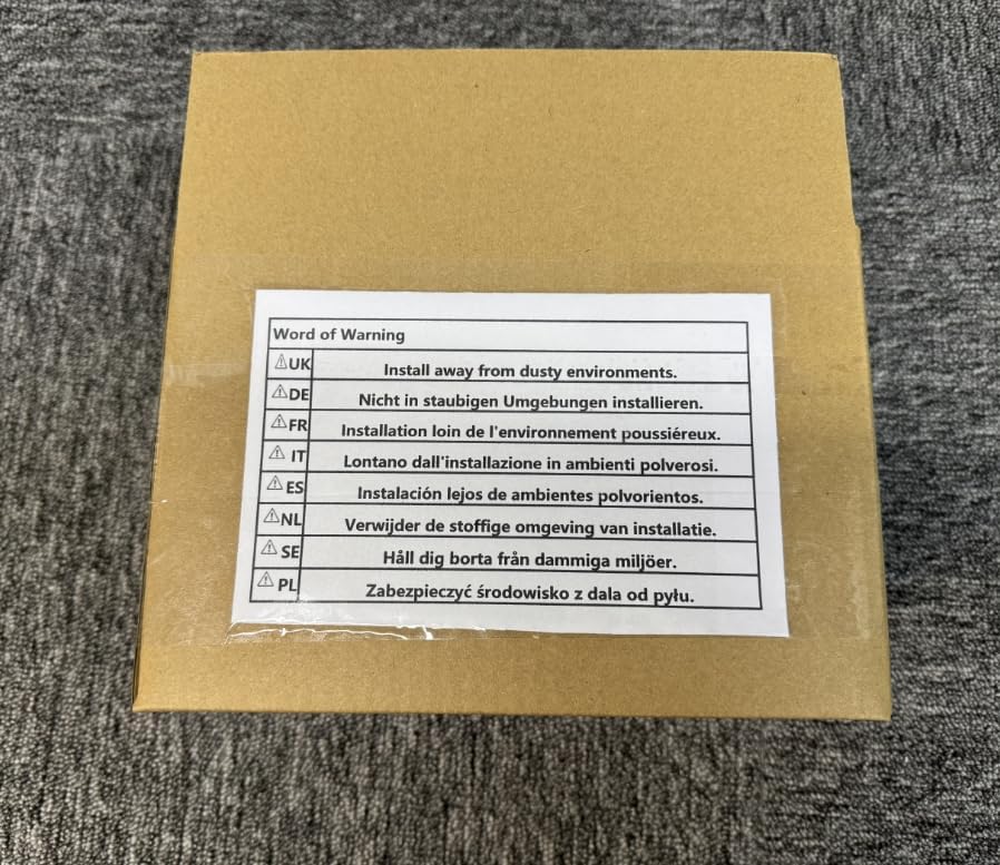Product box with a multi-language warning label, including 'Install away from dusty environments'