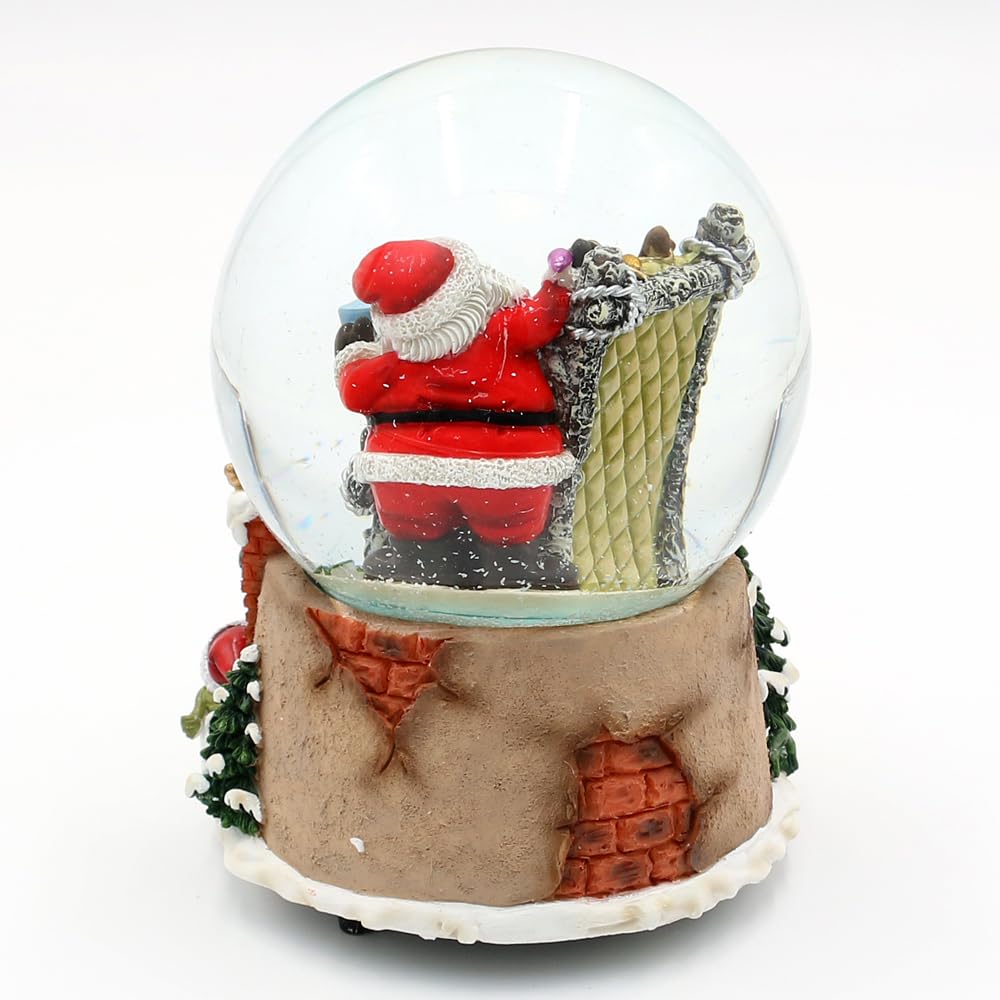 Schneekugel Rentier im Sessel und Weihnachtsmann, auf Kamin Sockel, mit Spielwerk, Melodie: Here Comes Santa Claus, L/B/H/Ø Kugel 11 x 11 x 15 cm Ø 10 cm.