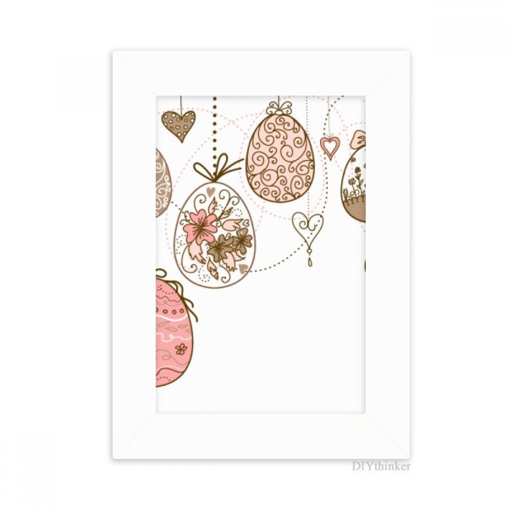 Peinture d'œuf de Pâques rose pour décorer le bureau avec un cadre photo blanc 5x7