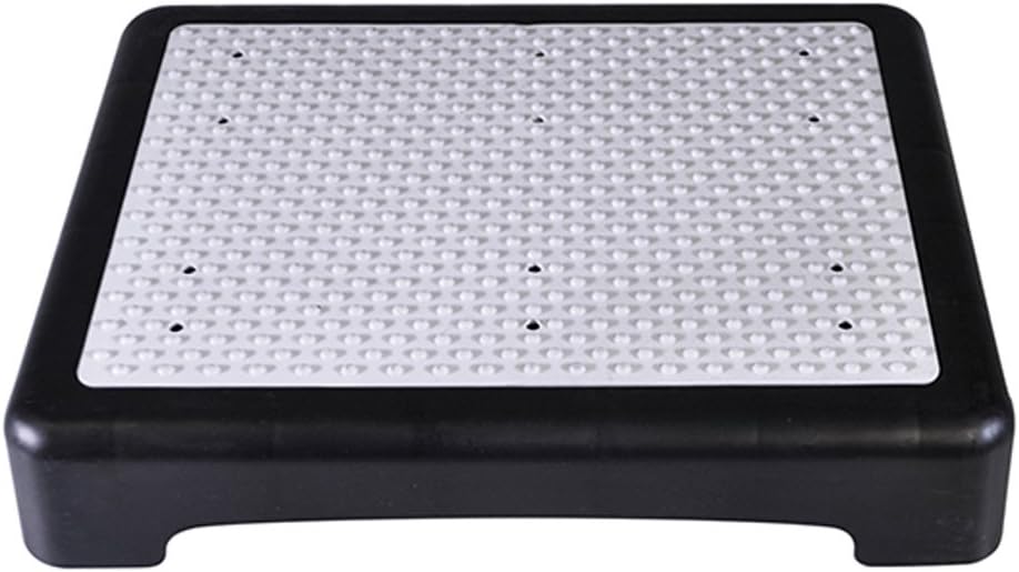 Aidapt Portable Anti-Slip Half Step placed in front of a brown door, demonstrating its use for easier access.