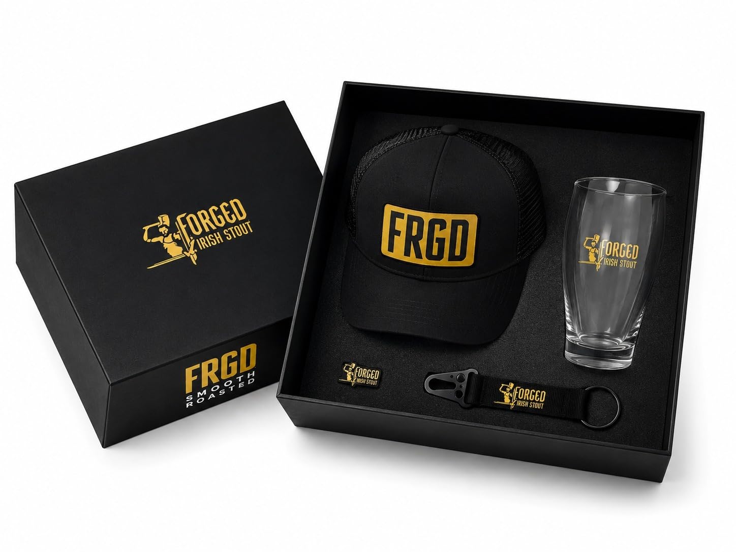 Forged Irish Stout FRGD Merchandise Gift Set – Official Dublin Ireland Fan Bundle | Black Snapback Trucker Cap, Pint Glass, Enamel Pin Badge & 2 Keychains | Irish Stout Lover Gift Box for Men