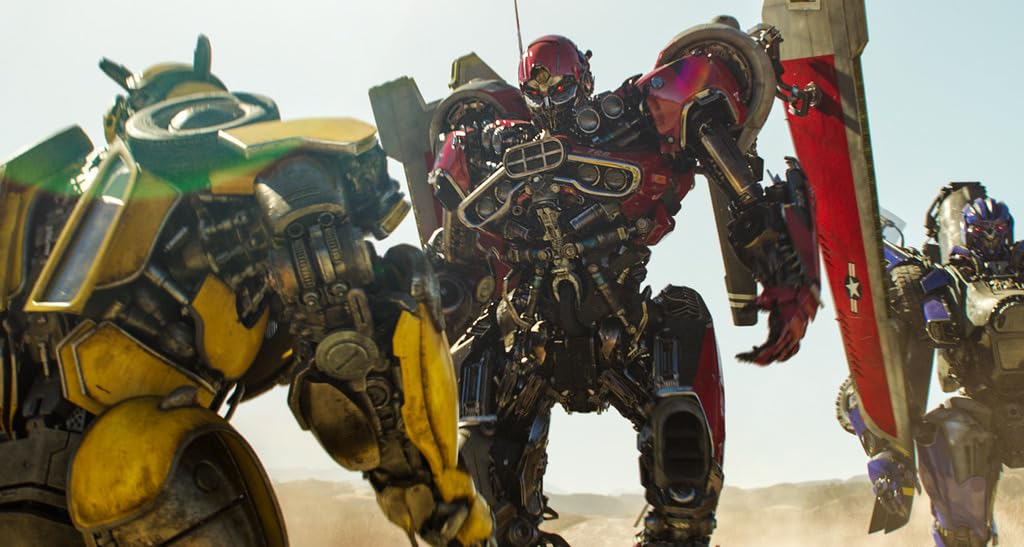 Still from Bumblebee movie showing Bumblebee and other Transformers in a desert setting.