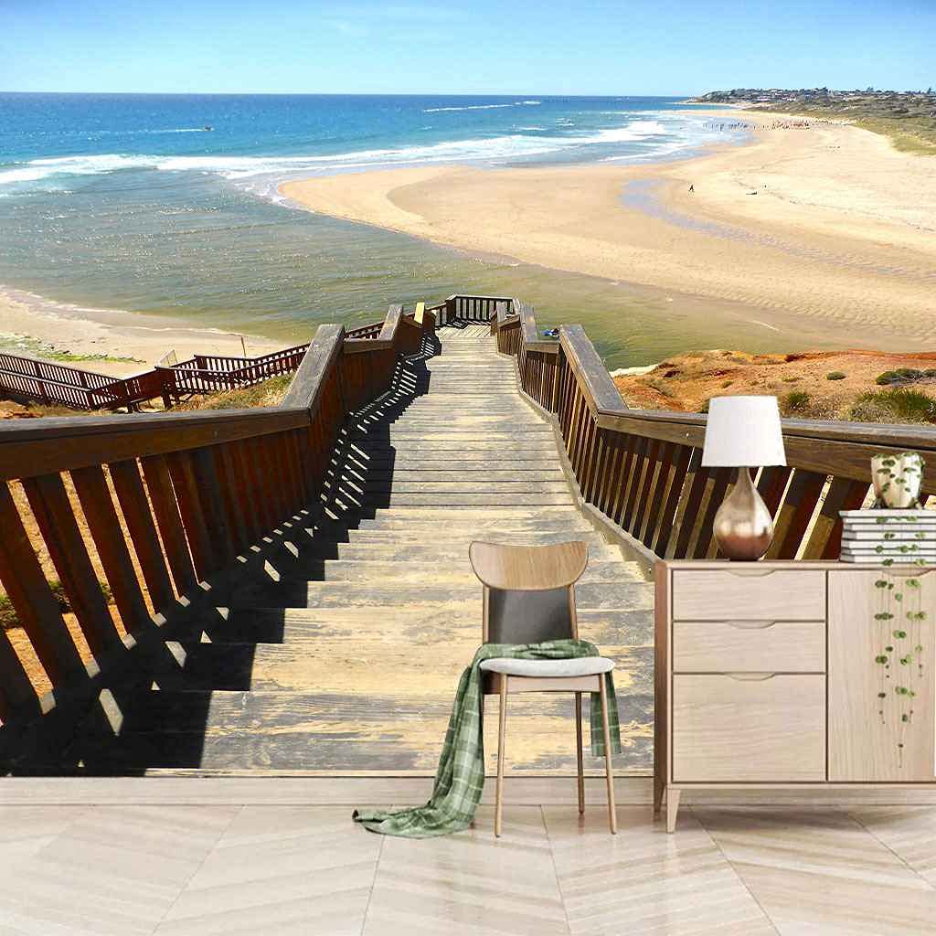 Papier peint plage en bois sur mer pour creer une ambiance evasion derriere le canape