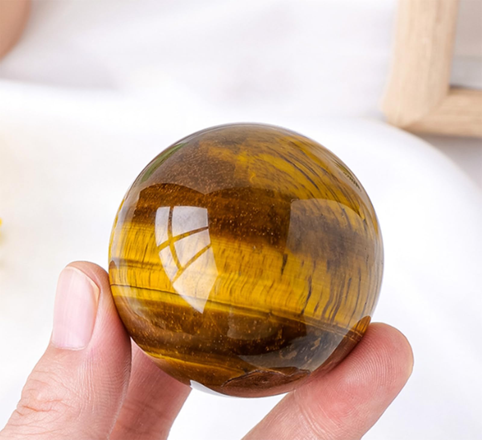 Esfera de ojo de tigre natural para decorar salones zen