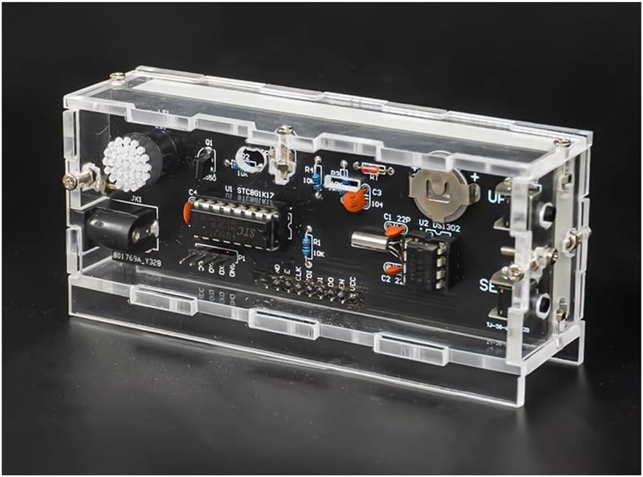 Assembled PCB board with various electronic components, including ICs, resistors, capacitors, and a battery holder, ready for casing.