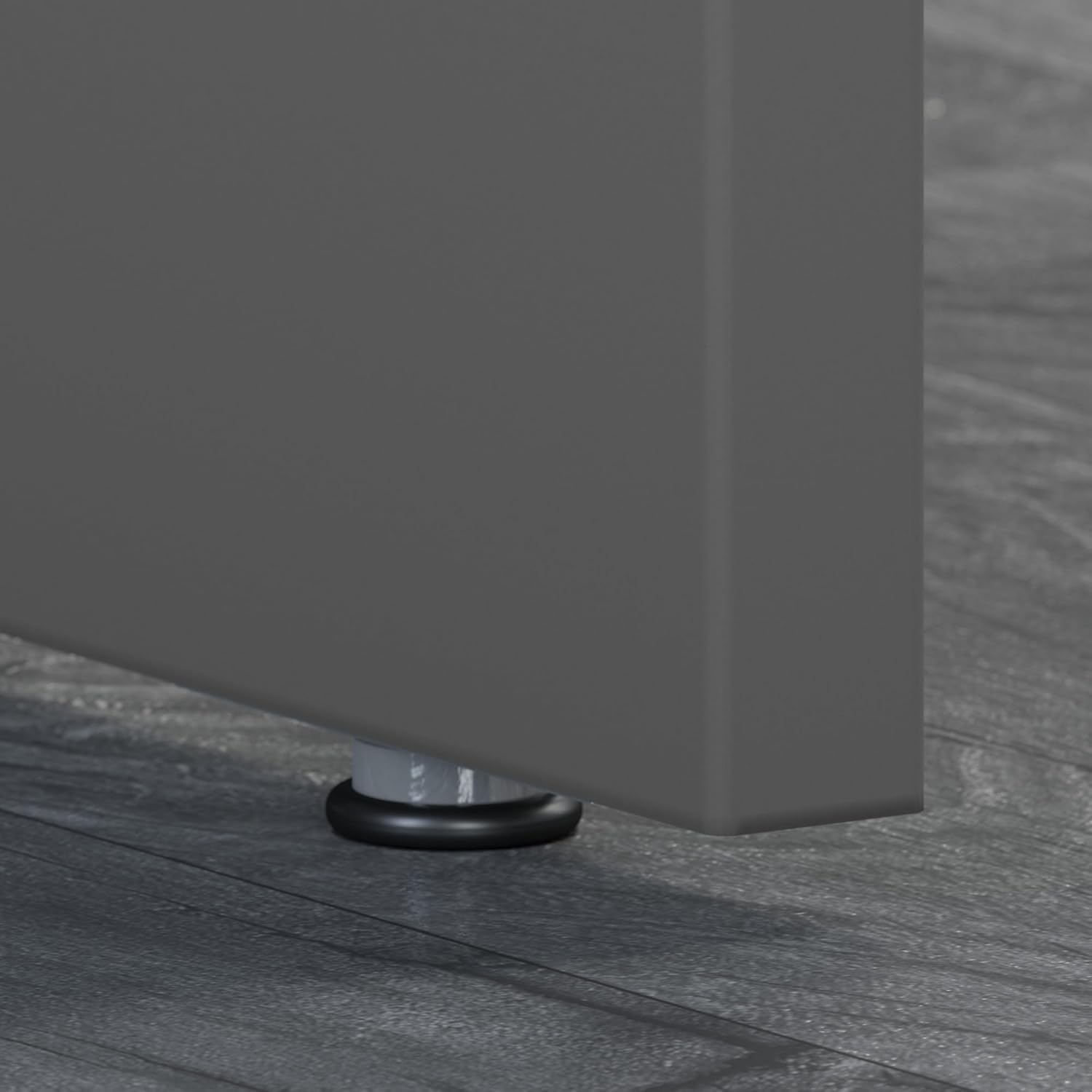 Close-up of an adjustable leveler on the bottom of the desk leg