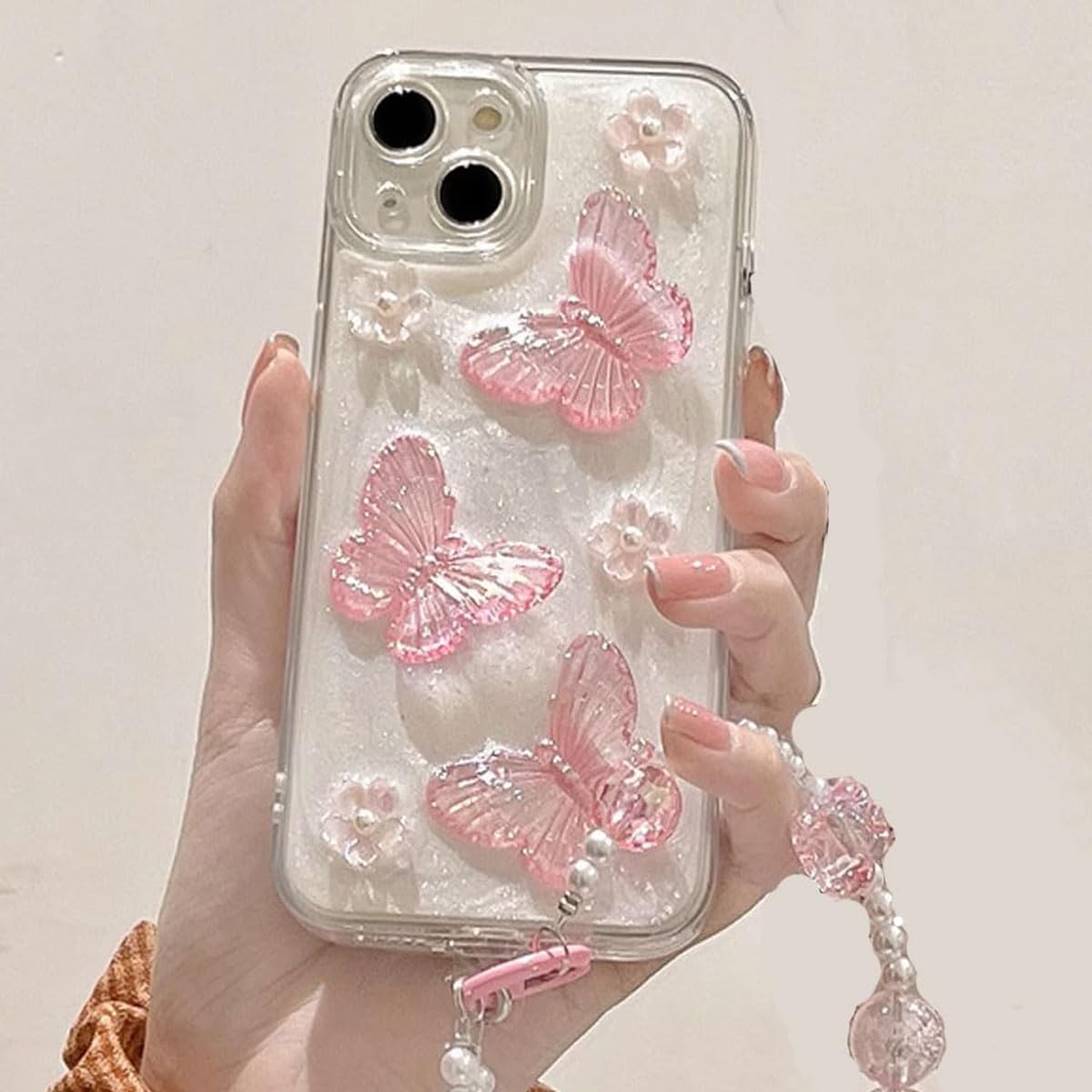 Changjia Funda protectora para iPhone con diseño de mariposa con purpurina en 3D, con perlas de cristal y correa para la muñeca, estética, suave, TPU, para mujeres y niñas (rosa)
