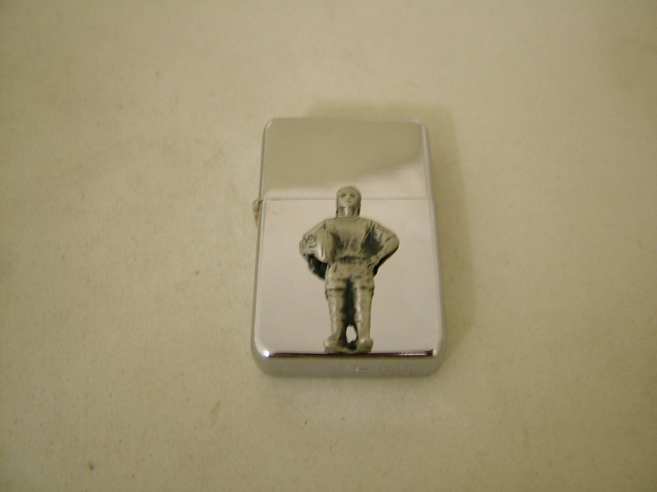 Cigarette case and lighter with rugby player badge