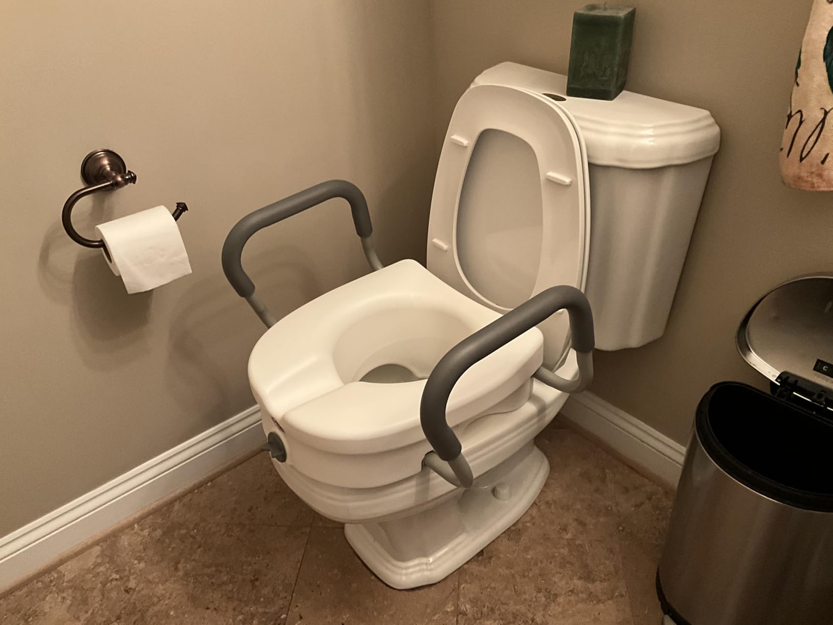 Carex E-Z Lock Raised Toilet Seat with handles on toilet