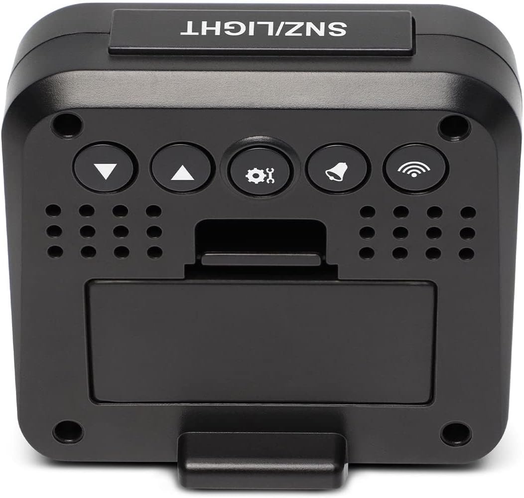 Zadní view of the Explore Scientific Travel Alarm Clock showing the battery compartment and control buttons.