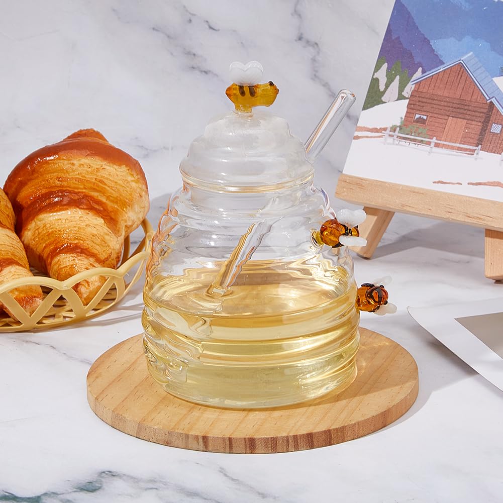 DICOSMETIC Barattolo per miele in vetro con cucchiaio e coperchio, contenitore per miele in vetro, trasparente, 11 x 12 x 13,5 cm, design a nido d'ape, per casa, cucina, regalo per sciroppo