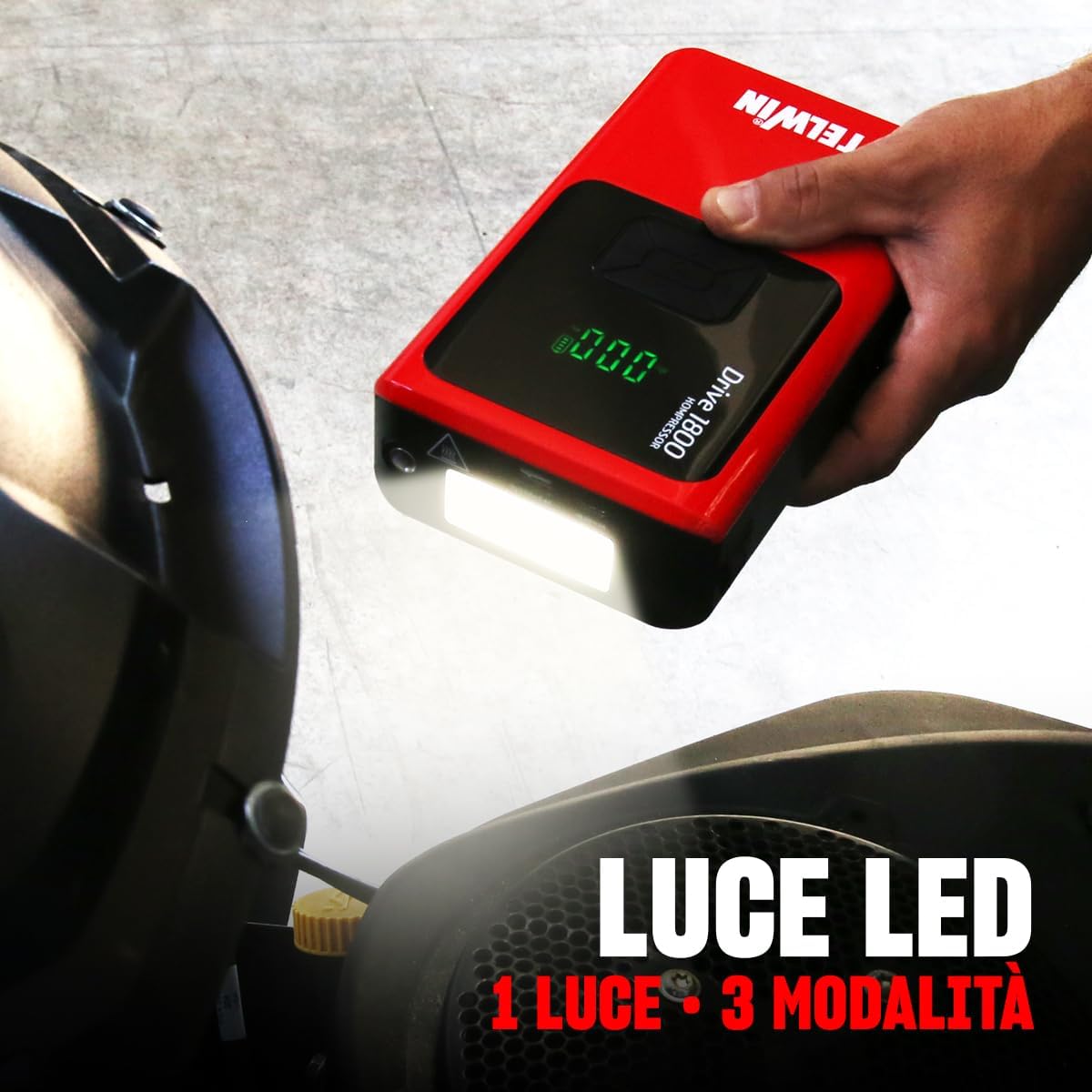 Telwin Drive 1800 Kompressor with its LED light activated, illuminating a dark area.