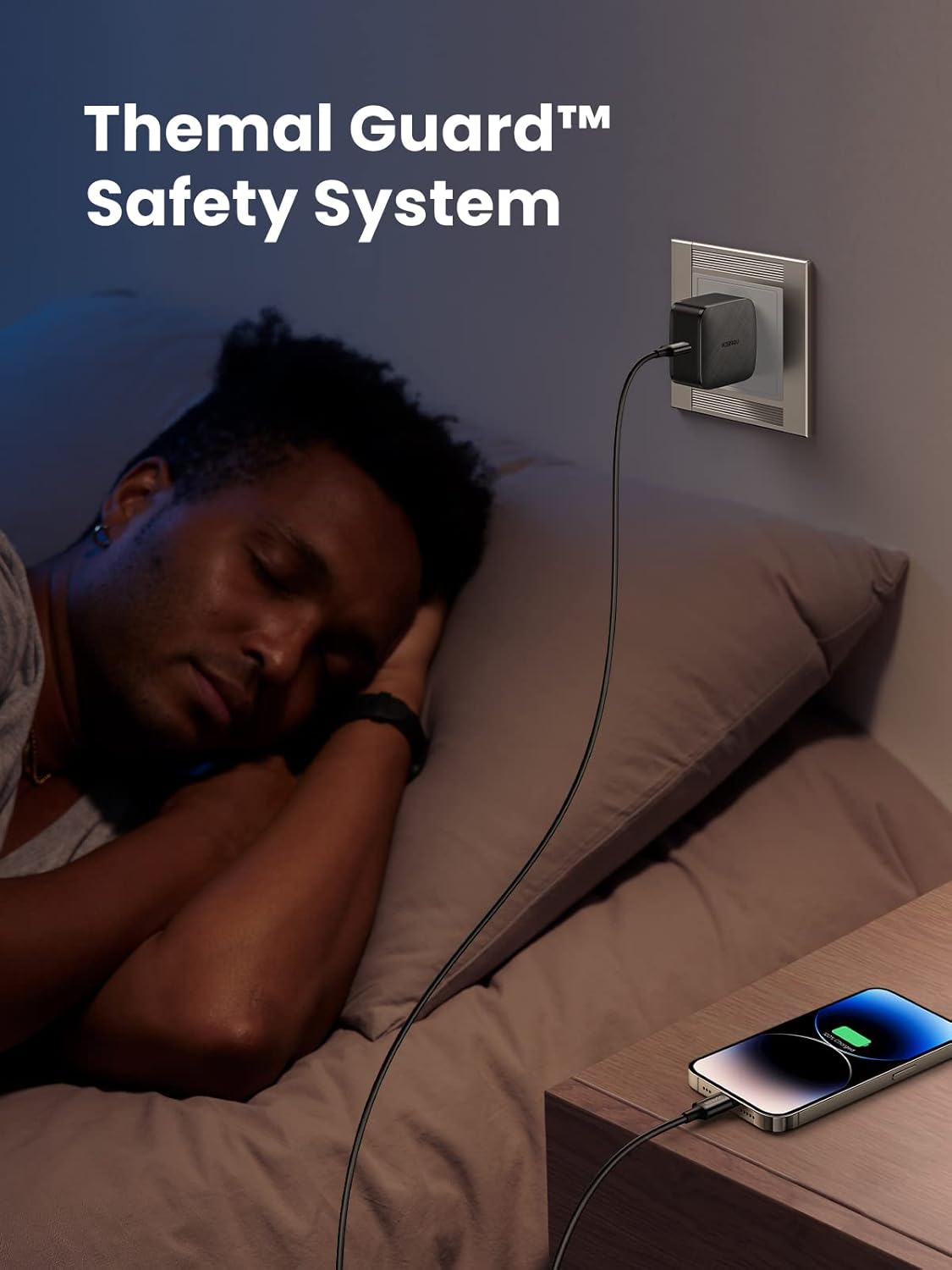 Image of a person sleeping while a phone is charging with the UGREEN charger, illustrating Thermal Guard Safety System