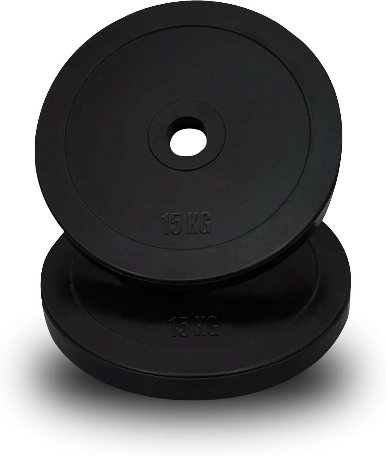 Black rubber Olympic weight plates stacked beside a barbell