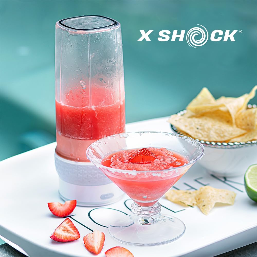 XShock Portable Blender next to a glass of blended drink and snacks, illustrating a prepared beverage.