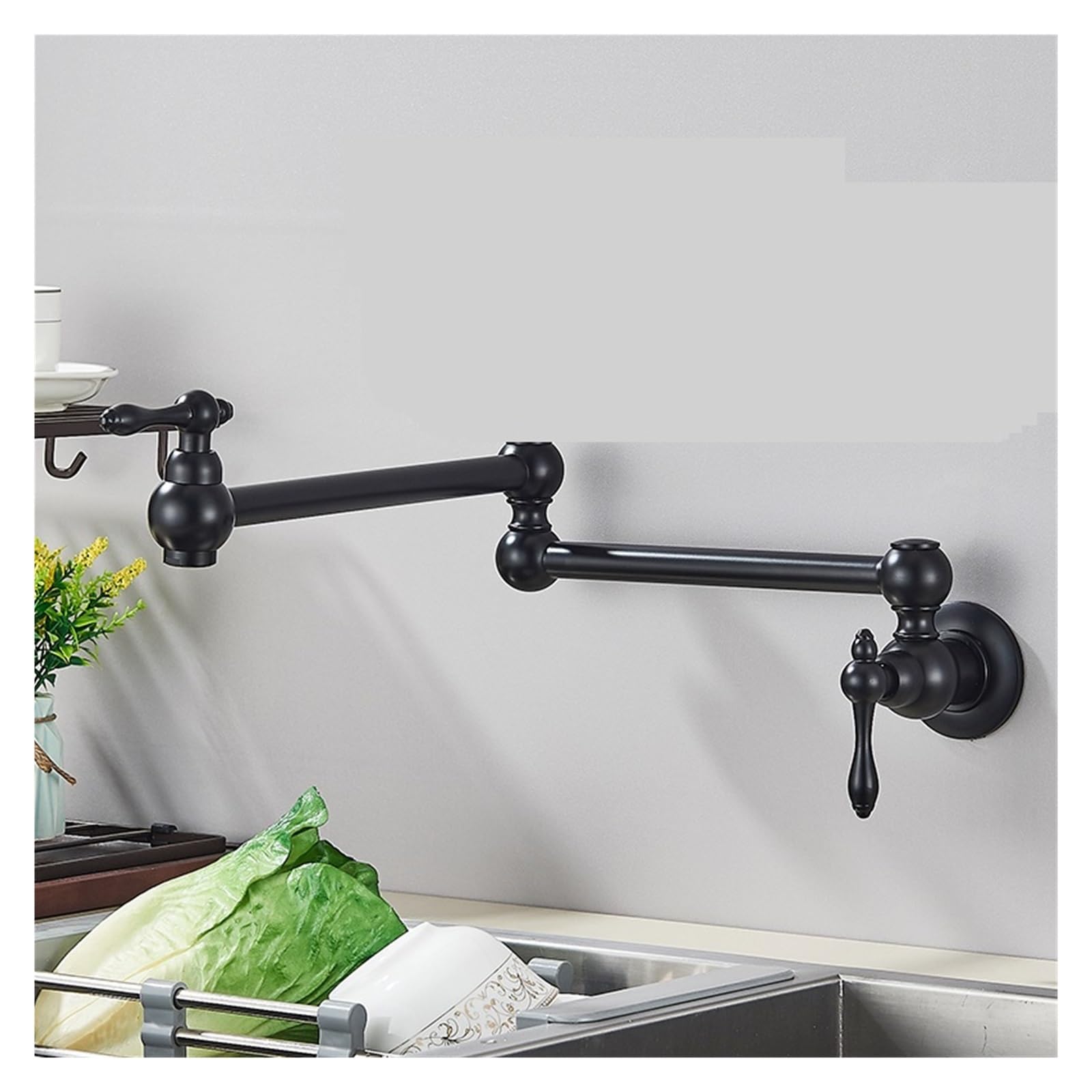 Robinet de cuisine mural noir mat pour remplir les casseroles sur la plaque de cuisson