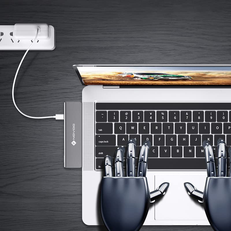 NOVOO 7-in-2 USB C Hub connected to a MacBook with a power adapter