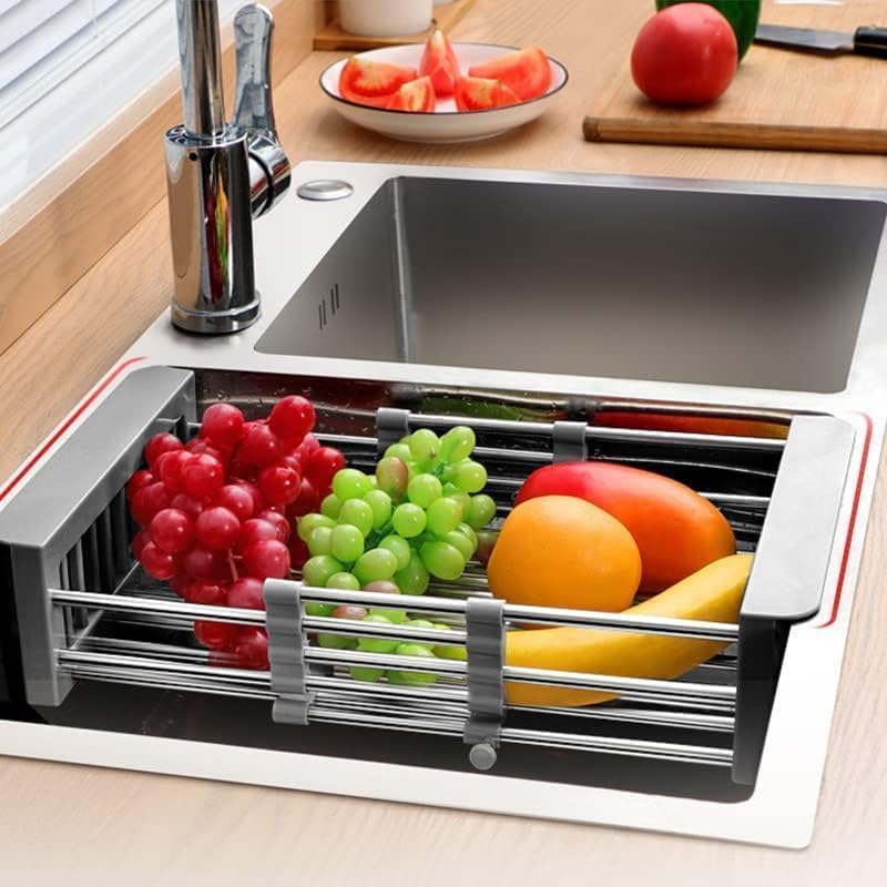 Cyrank dish drying rack holding plates and bowls over a sink for drying.