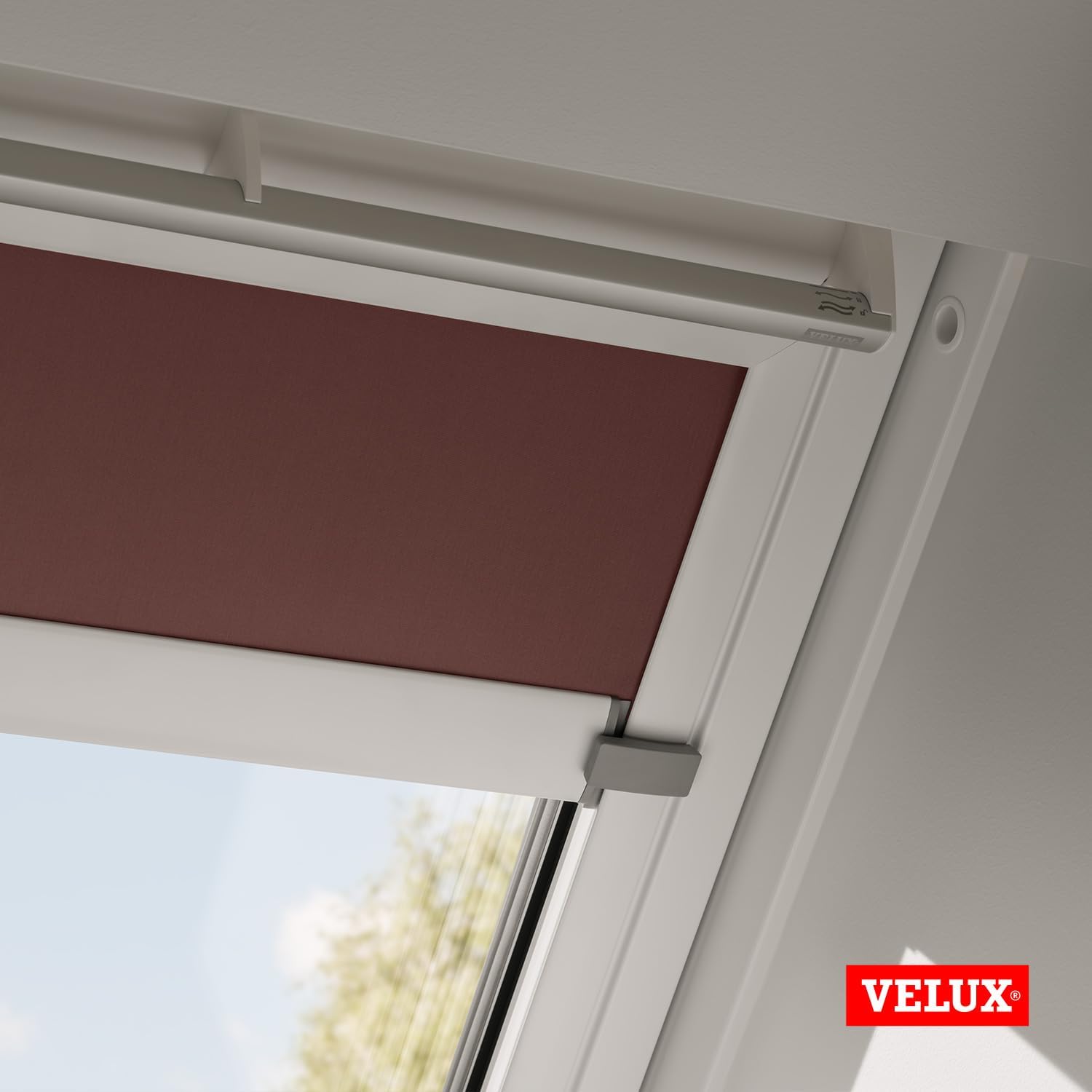 Close-up of the side guide mechanism of the VELUX blind.