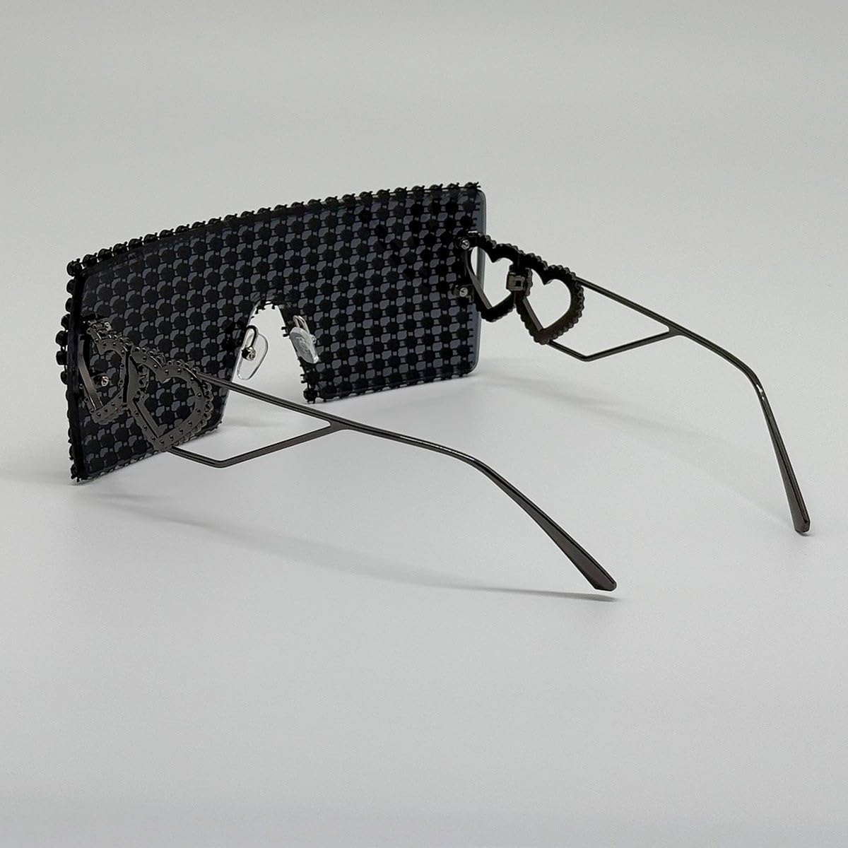Occhiali da sole da donna senza montatura, con design a cuore cavo in metallo, protezione UV400.