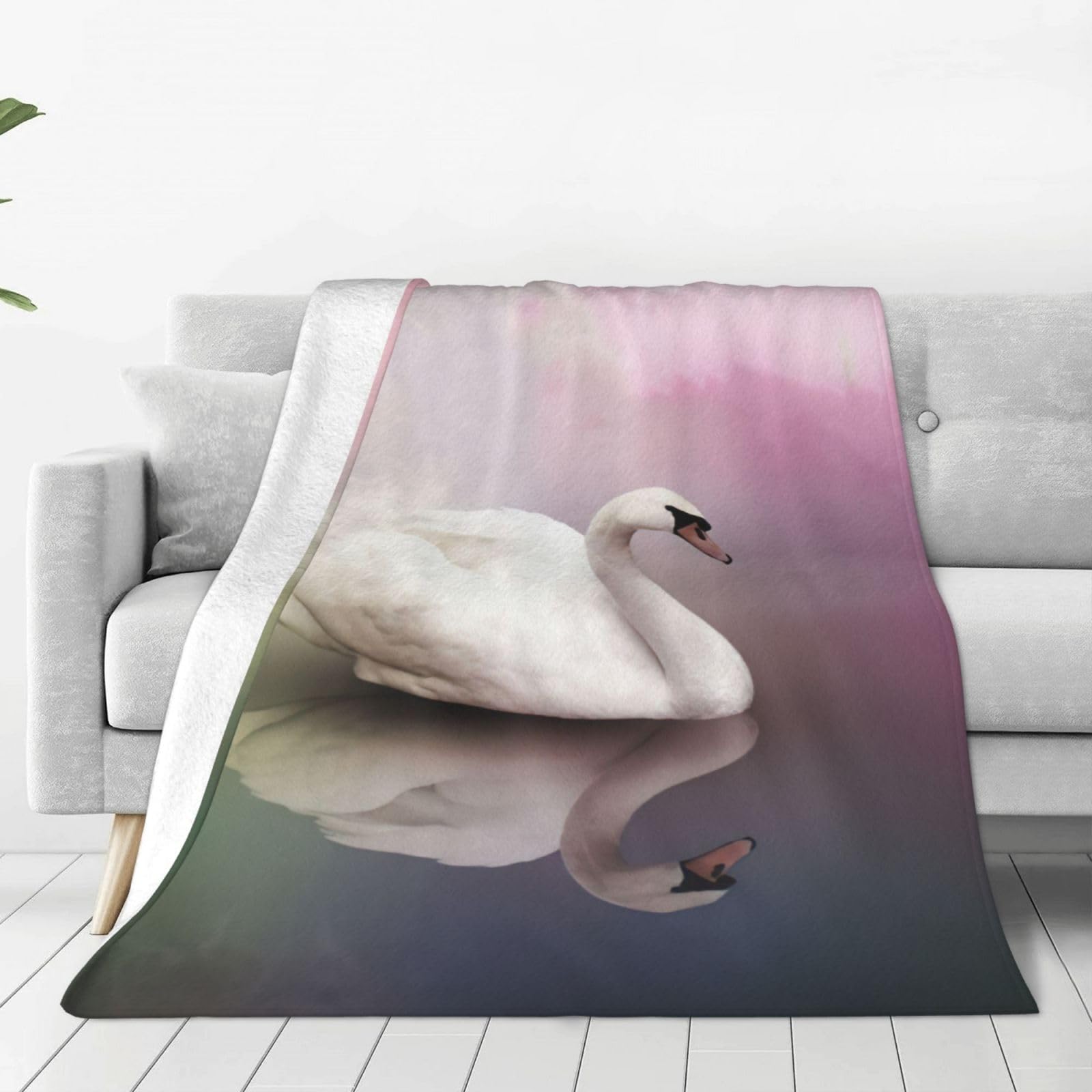 Couverture polaire cygne blanc contre le froid sur le lit et canapé