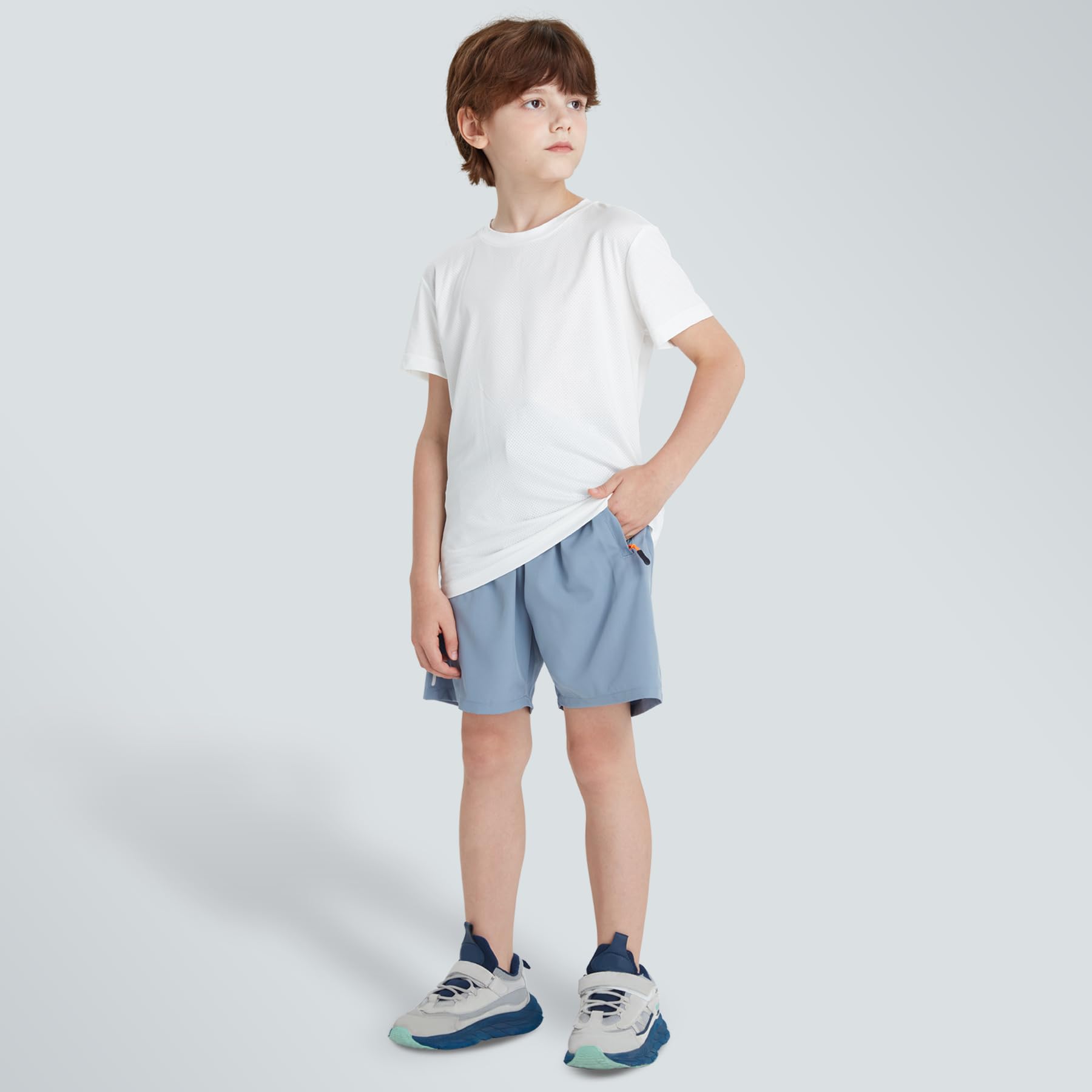 Pantalones cortos deportivos de secado rápido para niños con bolsillos con cremallera
