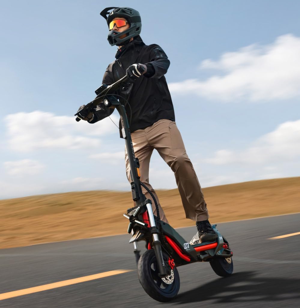 Person riding the Segway-Ninebot ZT3 PRO electric scooter on a paved road
