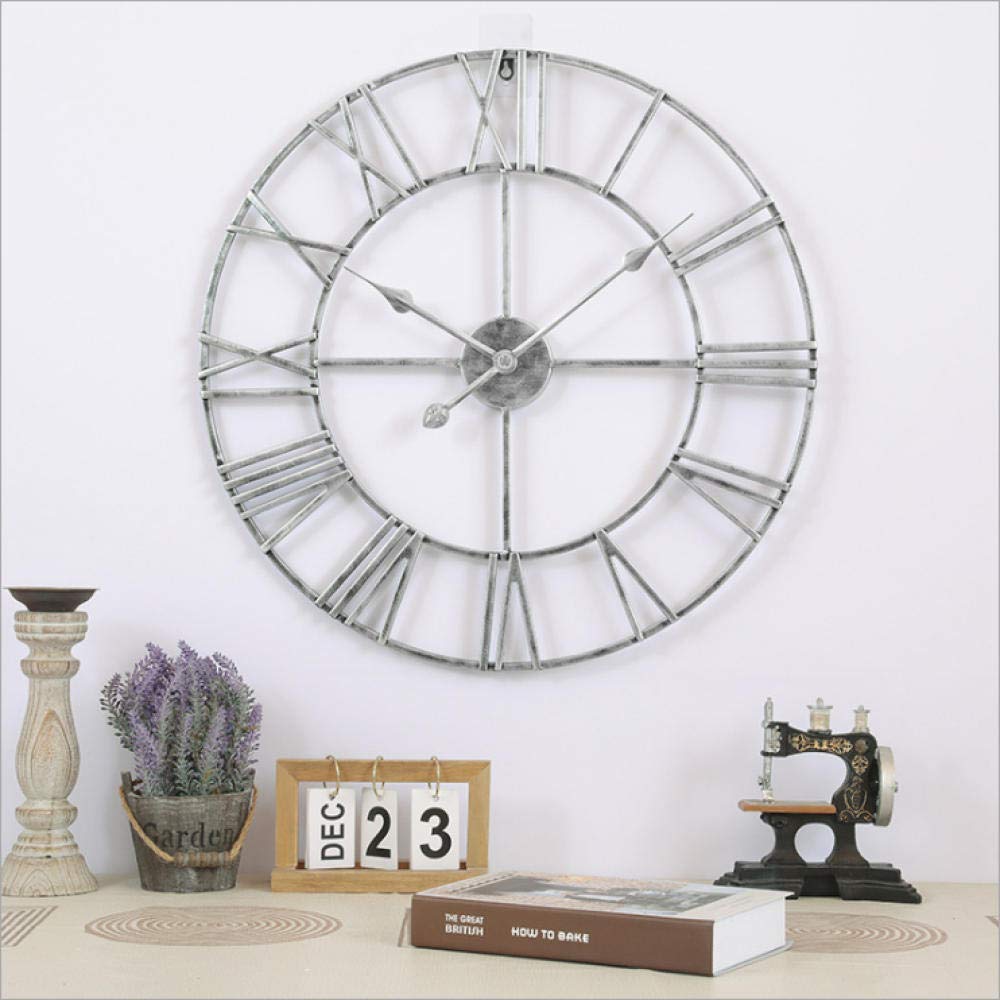 Horloge murale en fer argenté 60 cm de haute qualité au design ajouré chic