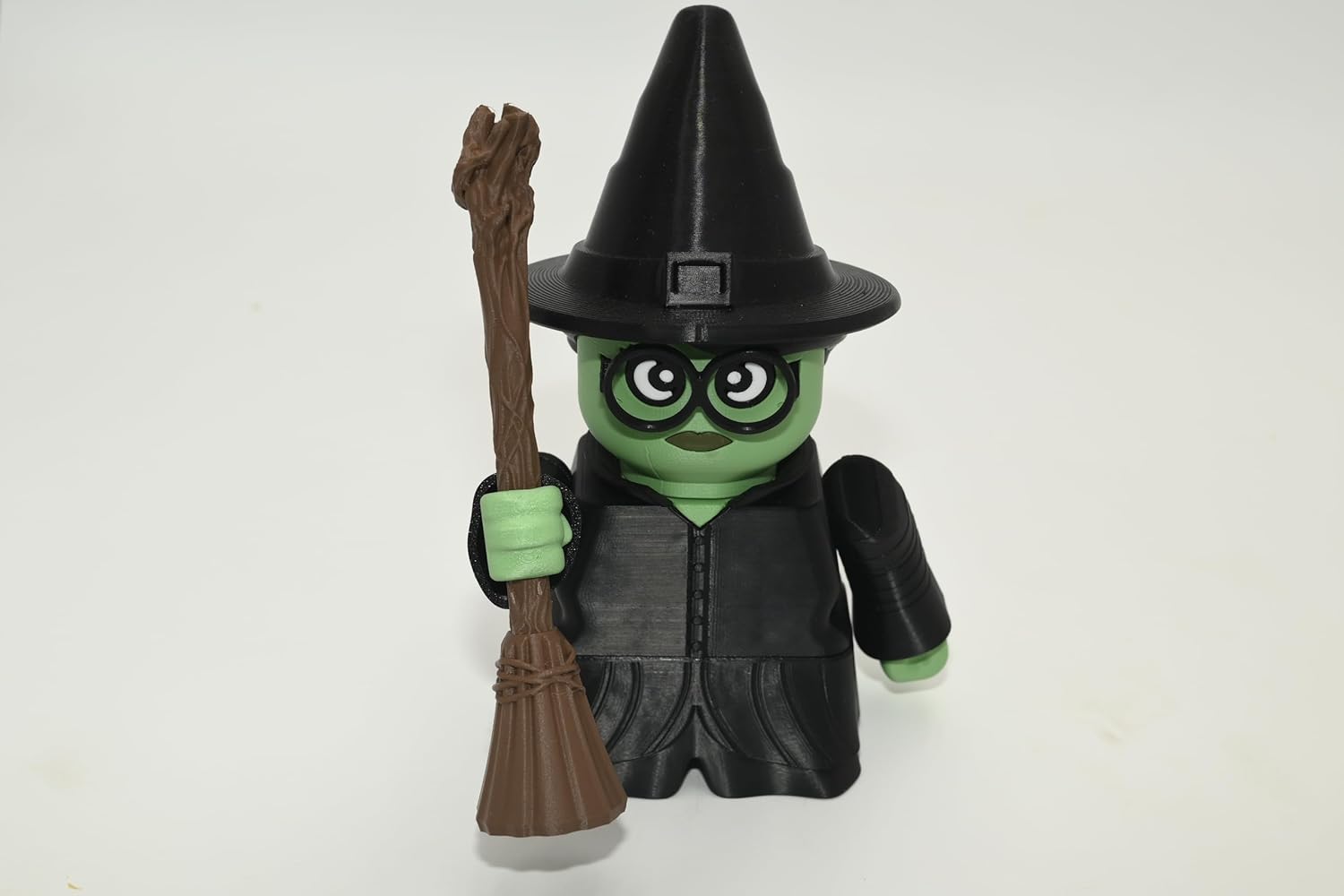 Elphaba Building Figure, Black and Green Plastic Character with Broomstick and Hat, 6.5 Inch Buildable Toy, Assembly Required, Ages 3+