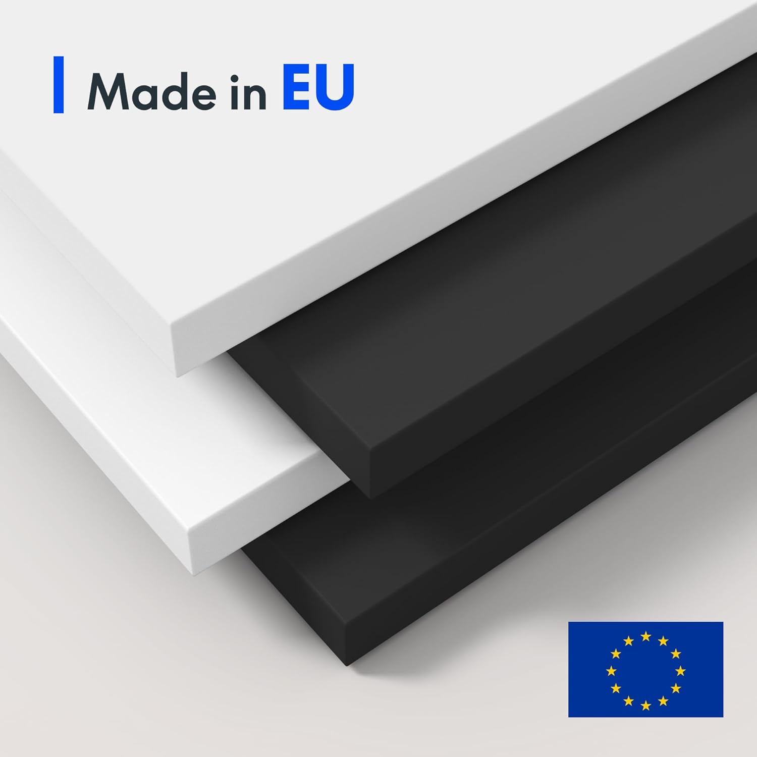 Stacked white and black desk tabletops with 'Made in EU' label