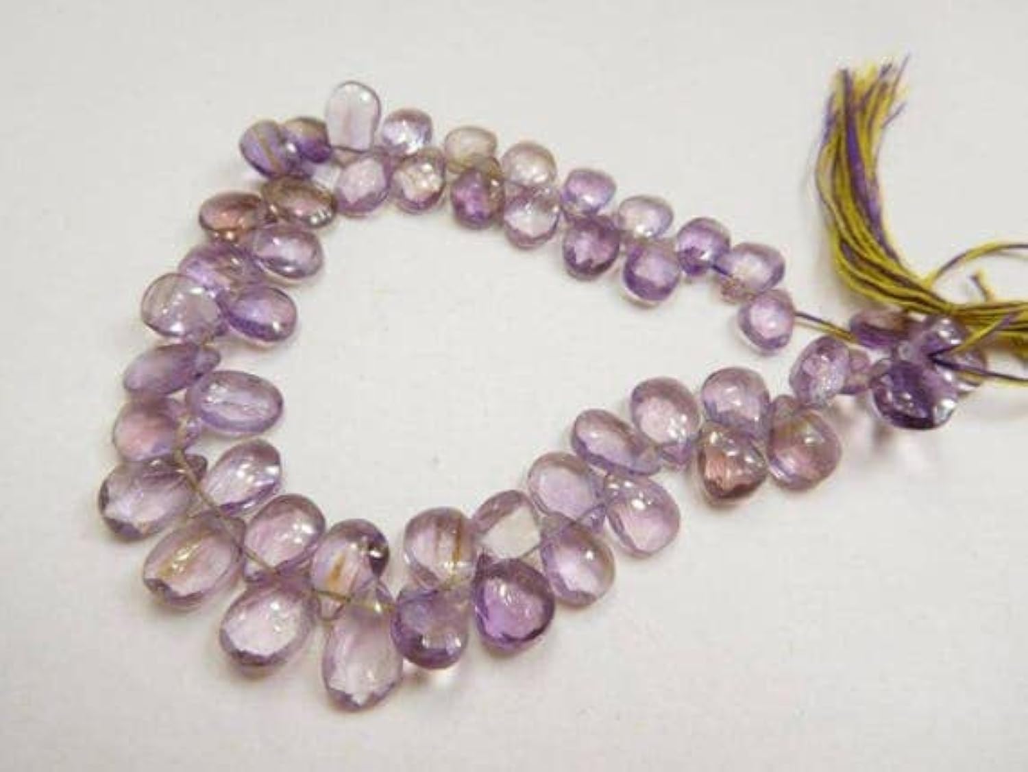 Perles amétrine briolette facettées en poire de 6x8-7x8mm pour création de bijoux uniques sur fil.