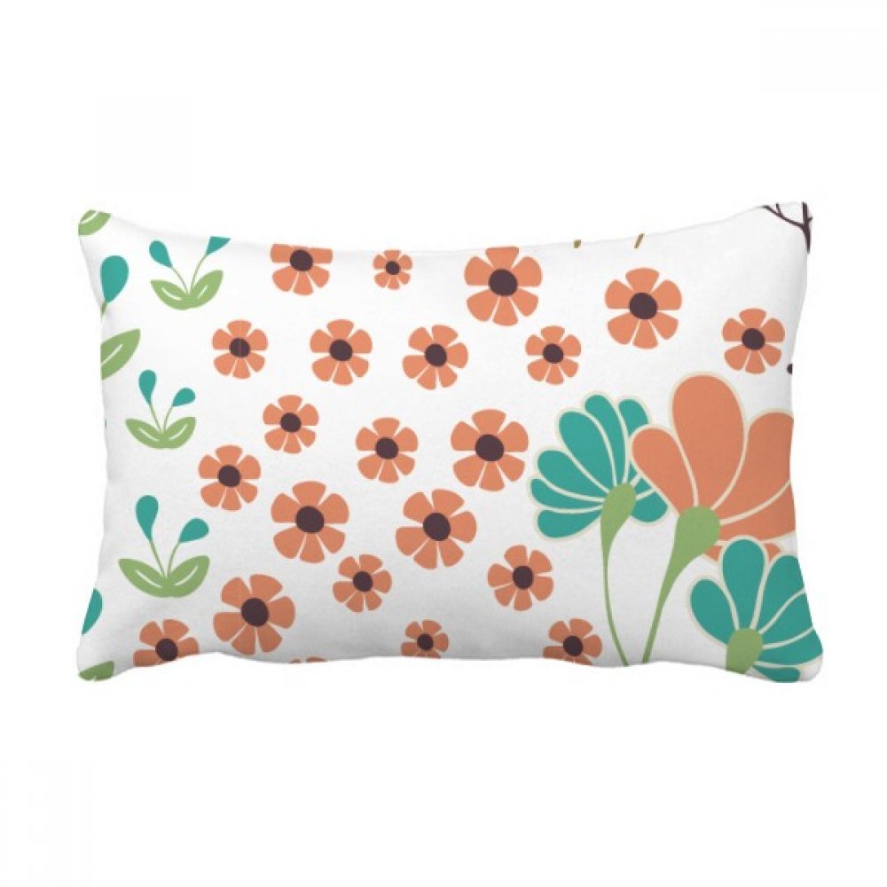 Coussin de décoration fleur orange pour créer un salon cocooning