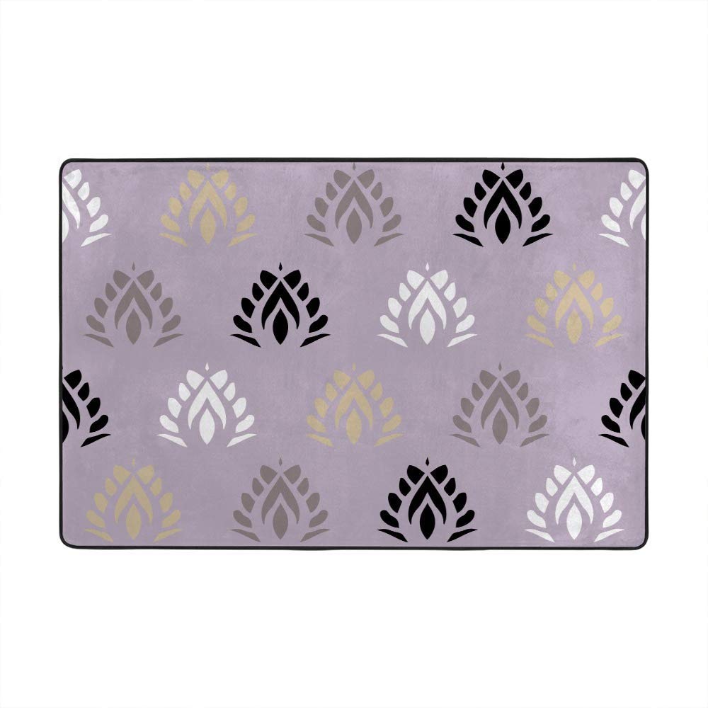 Grand tapis de sol noir et feuille d'or pour sublimer le salon ou la chambre