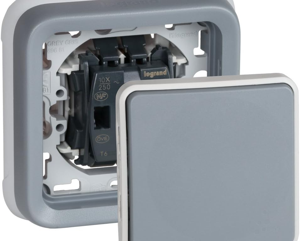 Legrand Plexo Recessed Switch with the grey front plate detached, illustrating how it connects to the internal mechanism.
