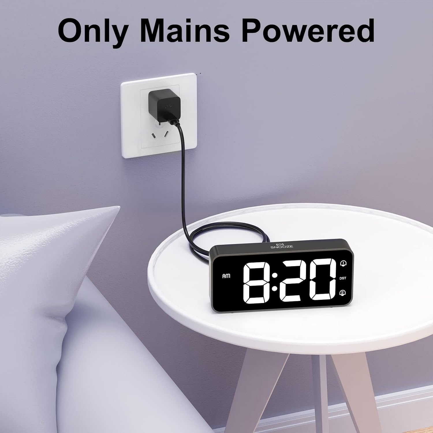 Alarm clock plugged into a wall outlet