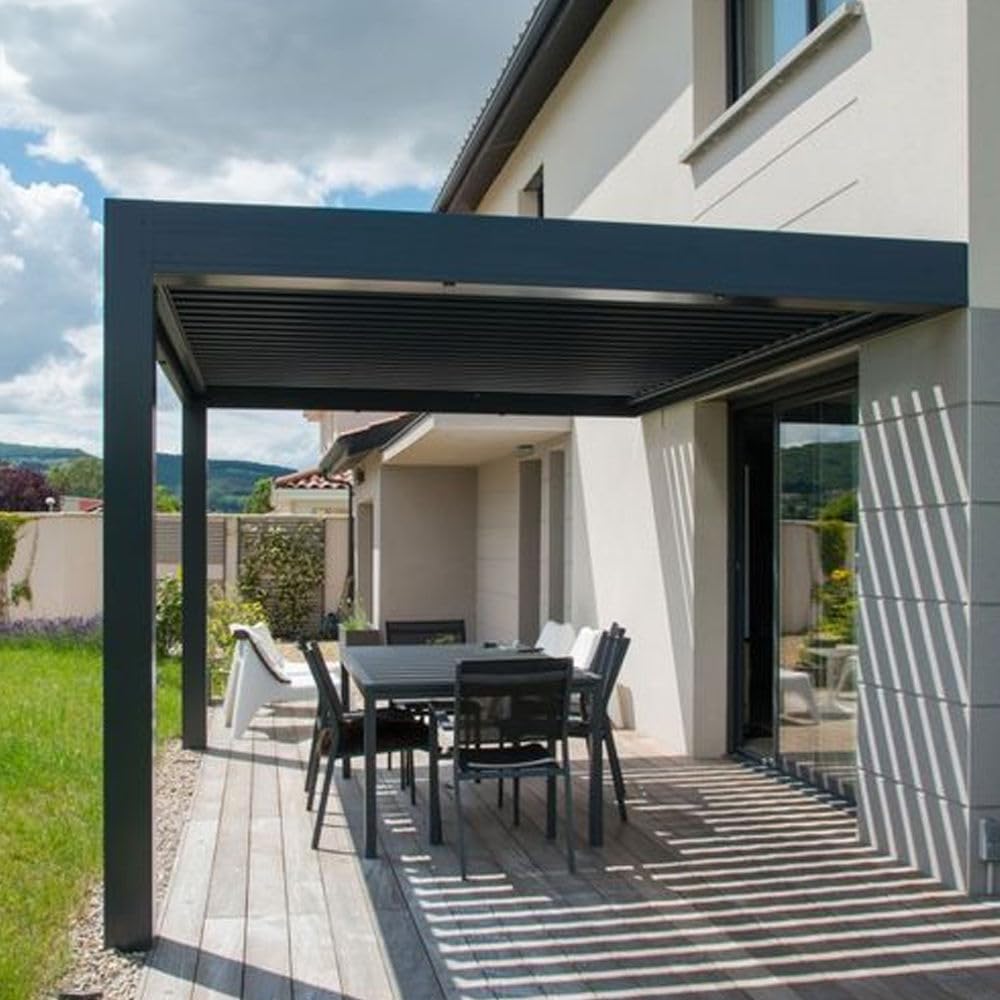 White bioclimatic pergola with open louvers on a patio