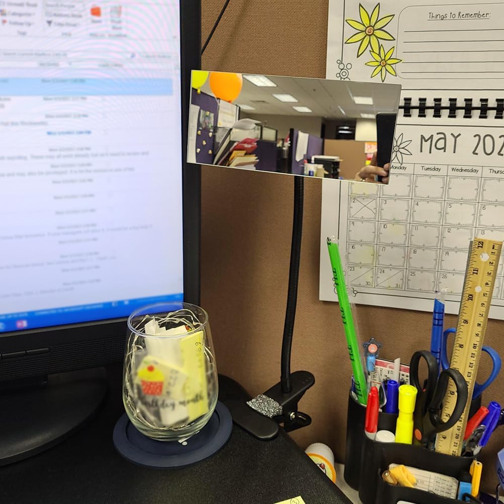 Ampper Clip On Security Mirror attached to a cubicle wall, showing a view of the office.