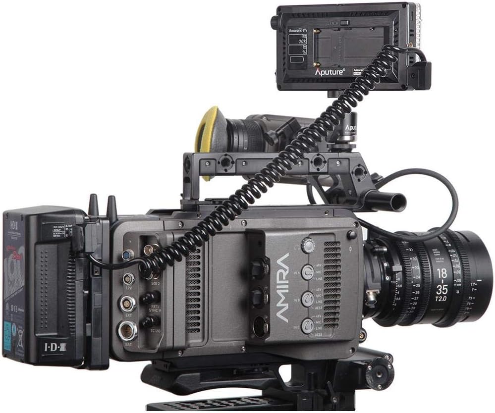 Aputure Amaran AL-F7 mounted on a professional camera rig via a hot-shoe adapter.