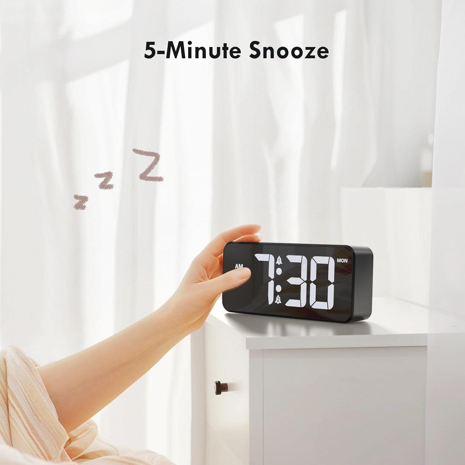 A hand reaching to press the snooze button on the alarm clock, indicating a 5-minute snooze.