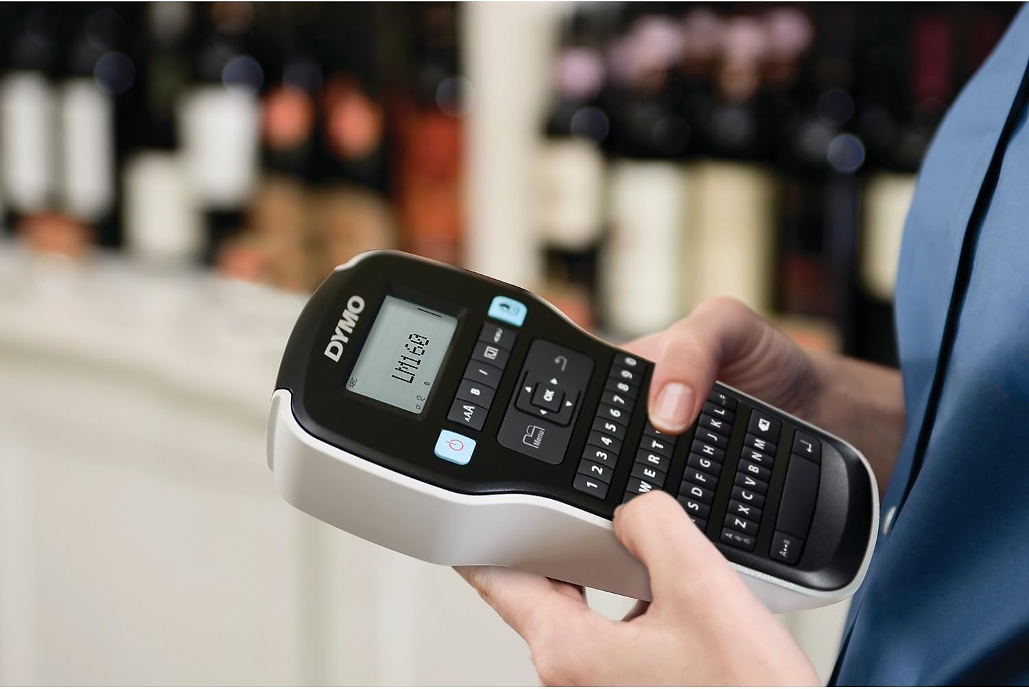 Person using the DYMO LabelManager 160 to type a label