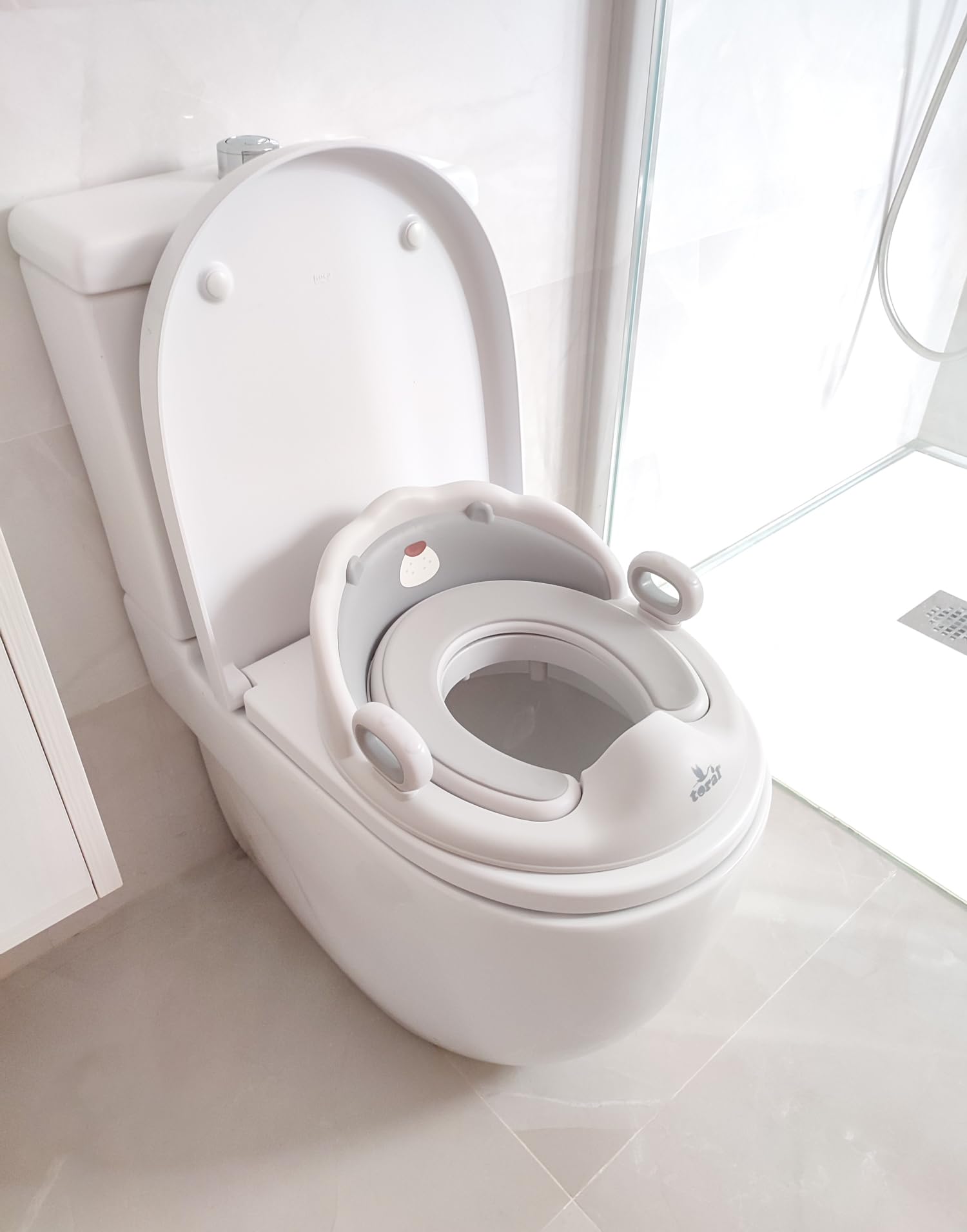 Toral Asiento Reductor con Asas para WC. Ayuda al aprendizaje de bebés y niños. Adaptador infantil portátil para váter MundiBebé +18 meses. Modelo Confort Osito