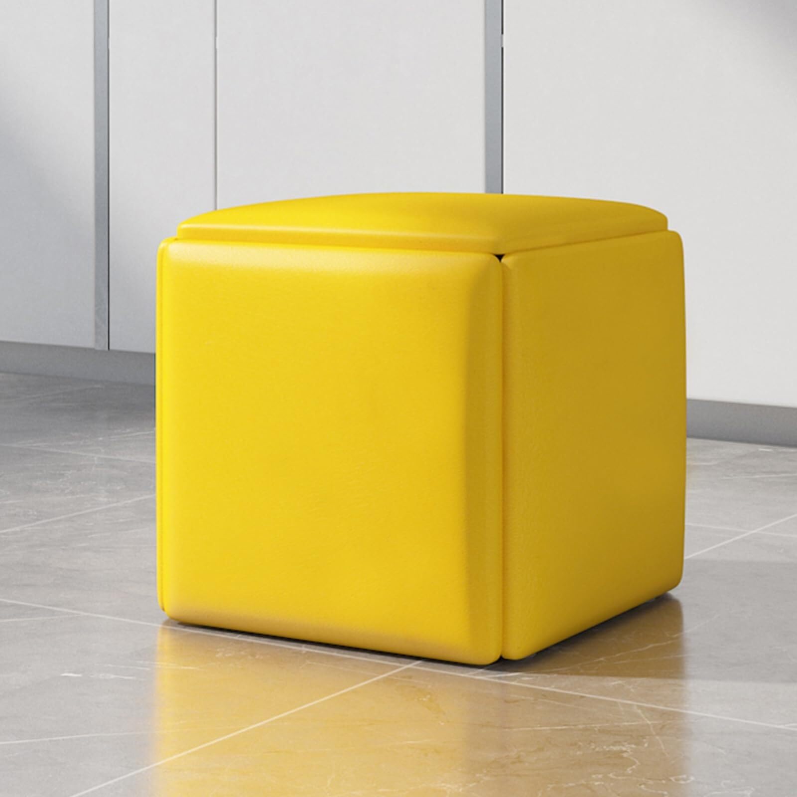 Taburete apilable 5 en 1 para optimizar el espacio en tu salón con su reposapiés móvil amarillo