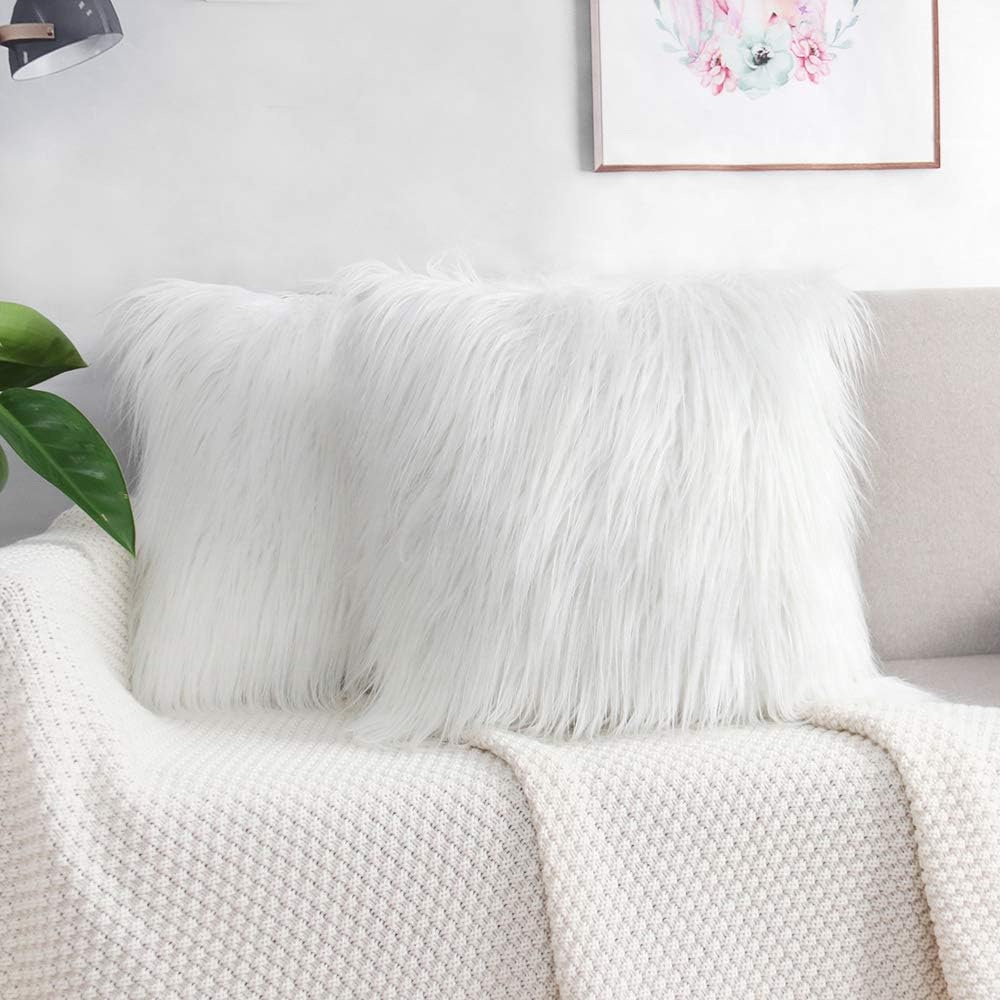 white furry throw pillows