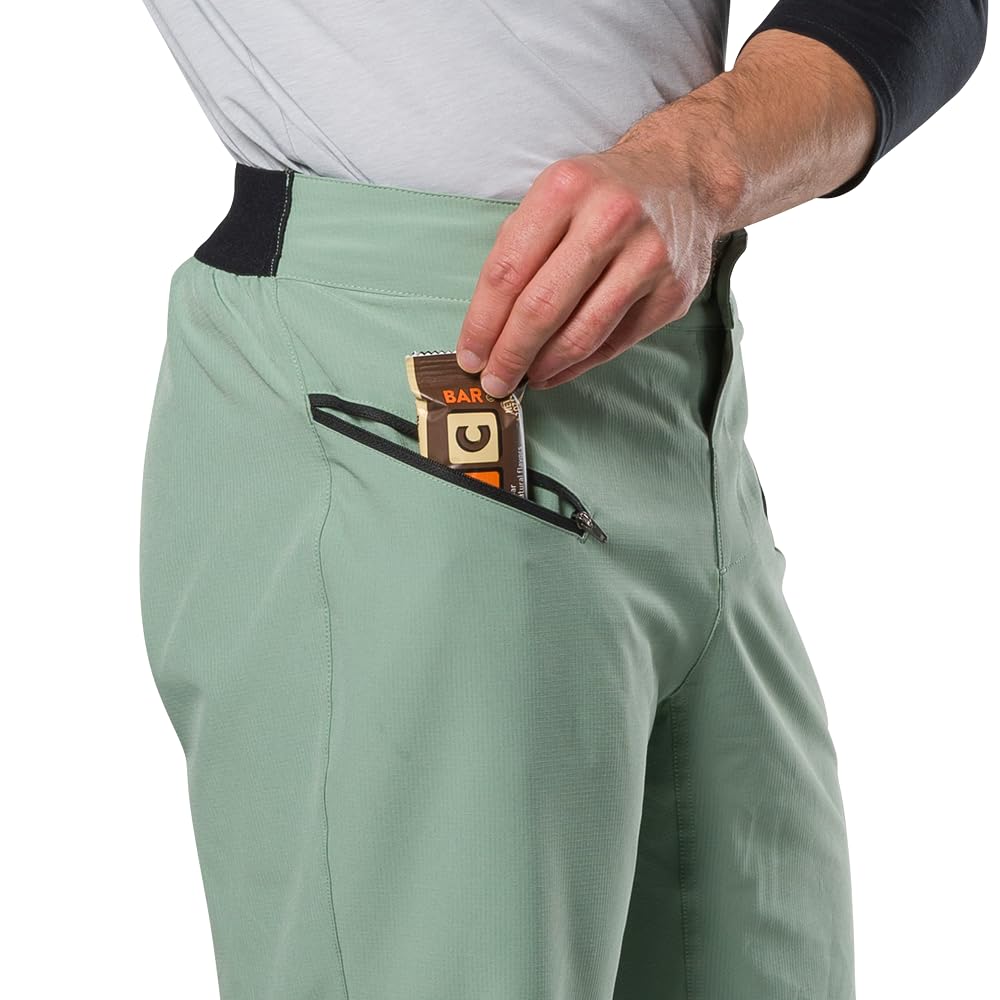 PEARL IZUMI Pantalón corto de ciclismo de montaña para hombre. Forro de gamuza desmontable y dos bolsillos con cremallera. Entrepierna cómoda y duradera de 11.5 pulgadas.