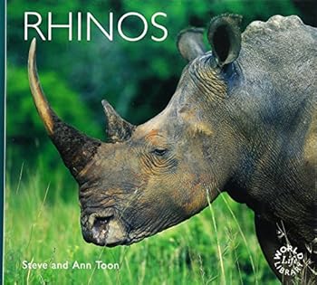 Paperback Rhinos (Worldlife Library) Book
