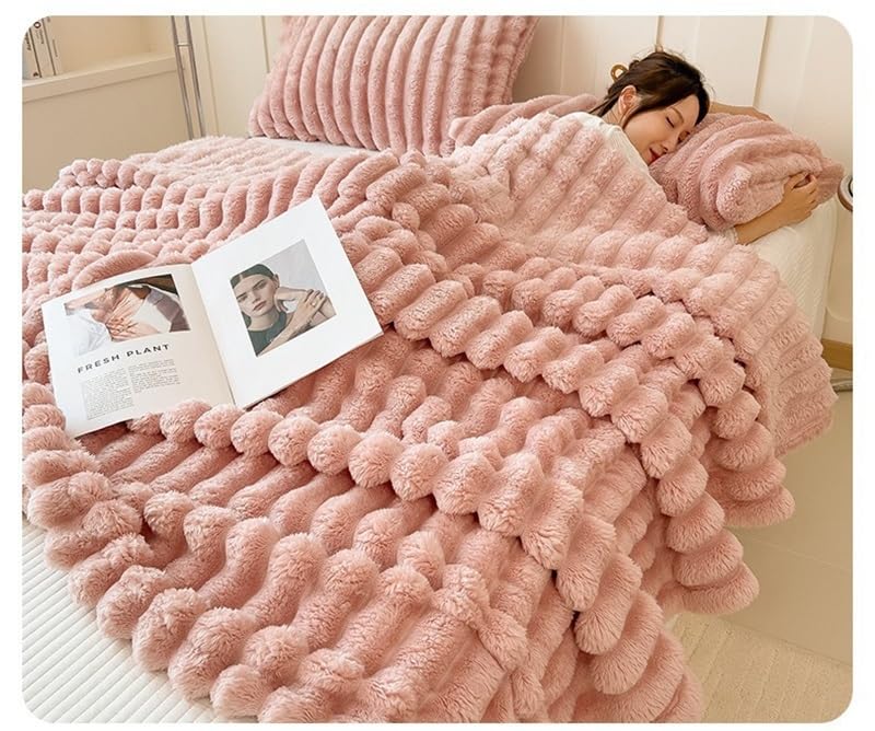 Plaid doux fausse fourrure rose contre le froid lit